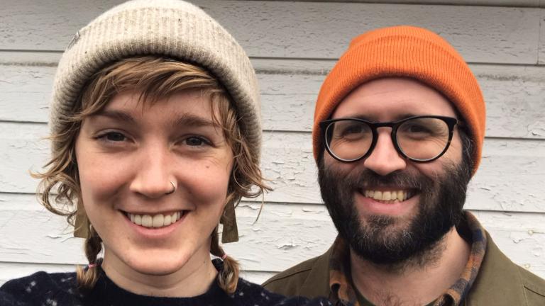 Owners smiling at camera