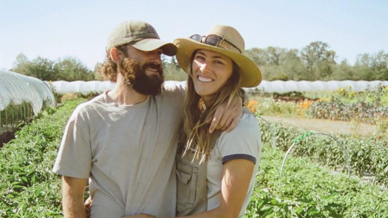 Owners in front of field