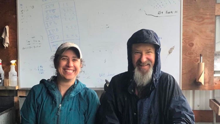 Owners cleaning greens